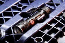 Built-in, high-intensity, rechargeable LED flashlight in the rear aftermarket motorcycle seat from Sargent, shown with Performance Plus All Black.